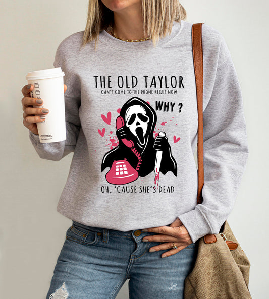 Woman wearing white Old Taylor can't come to the phone t-shirt with Ghostface graphi