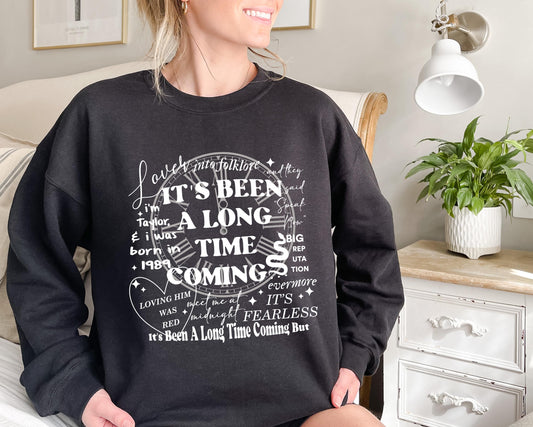 Black Taylor Swift Eras Tour intro sweatshirt with album lyric design.