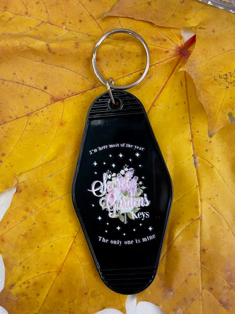 “Secret Gardens” Keychain – I Hate It Here Inspired Motel Tag
